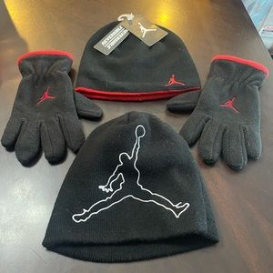Air Jordan youth beanies (2) and a pair of gloves.